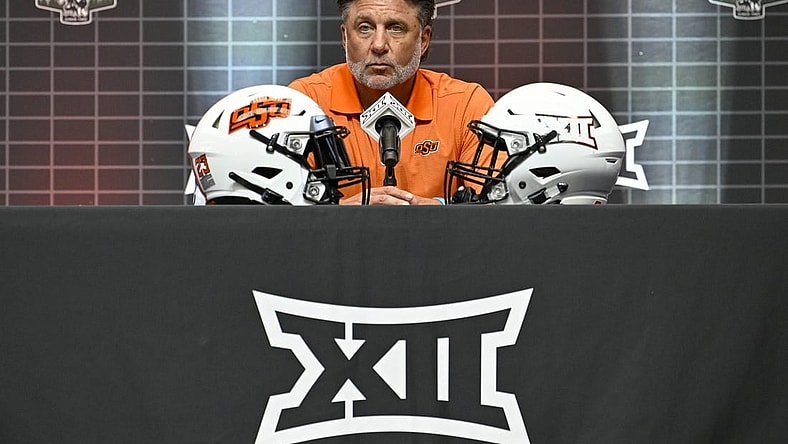 Jul 12, 2023; Arlington, TX, USA; Oklahoma State head coach Mike Gundy is interviewed during Big 12 football media day at AT&T Stadium. Mandatory Credit: Jerome Miron-USA TODAY Sports