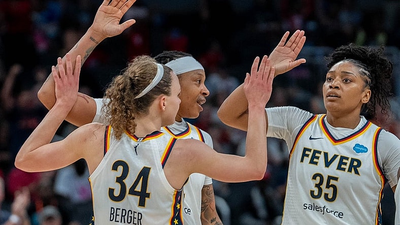 Grace Berger, Emma Cannon and Victoria Vivians celebrate after Berger made a basket during their game against the New York Liberty Wednesday, July 12, 2023 in Gainbridge Fieldhouse in Indianapolis.
