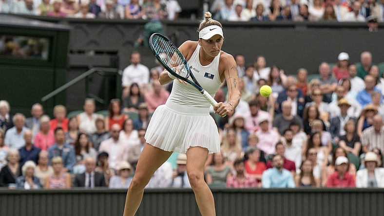 Jul 13, 2023; London, United Kingdom; Marketa Vondrousova (CZE) returns a shot during her match against Elina Svitolina (UKR) on day 11 at the All England Lawn Tennis and Croquet Club.  Mandatory Credit: Susan Mullane-USA TODAY Sports