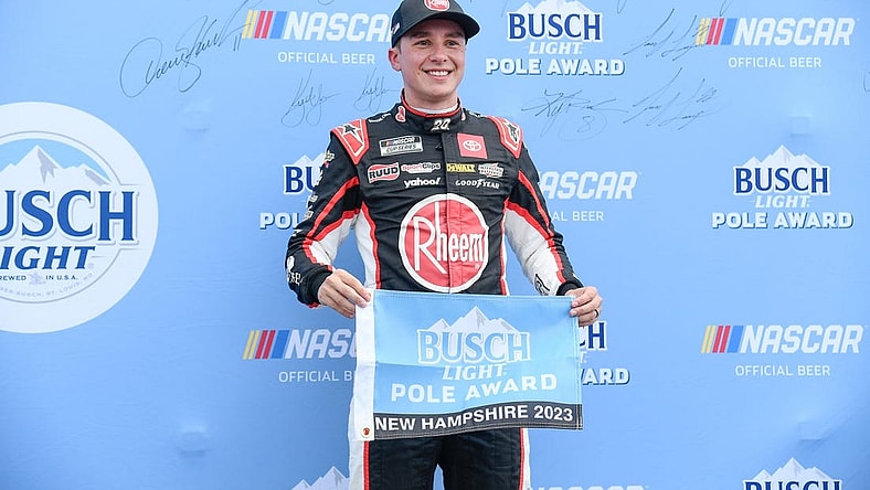 Jul 15, 2023; Loudon, New Hampshire, USA;NASCAR Cup Series driver Christopher Bell (20) celebrates winning the #1 pole position for the Crayon 301 at New Hampshire Motor Speedway. Mandatory Credit: Eric Canha-USA TODAY Sports