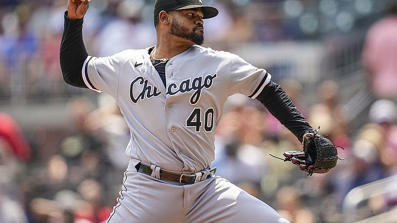 Jul 16, 2023; Cumberland, Georgia, USA; Chicago White Sox relief pitcher Reynaldo Lopez (40) pitches against the Atlanta Braves during the seventh inning at Truist Park. Mandatory Credit: Dale Zanine-USA TODAY Sports