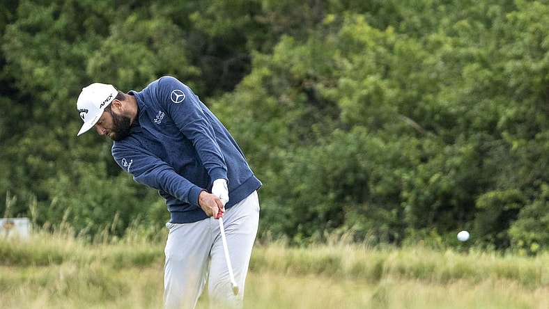 July 17, 2023; Hoylake, ENGLAND, GBR; Jon Rahm hits his fairway shot on the eighth hole during a practice round of The Open Championship golf tournament at Royal Liverpool. Mandatory Credit: Kyle Terada-USA TODAY Sports