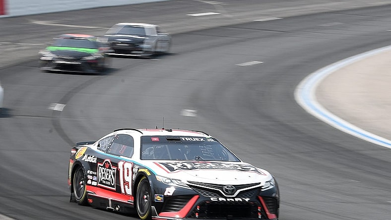 Jul 17, 2023; Loudon, New Hampshire, USA; NASCAR Cup Series driver Martin Truex Jr. (19) races into turn two during the Crayon 301 at New Hampshire Motor Speedway. Mandatory Credit: Eric Canha-USA TODAY Sports