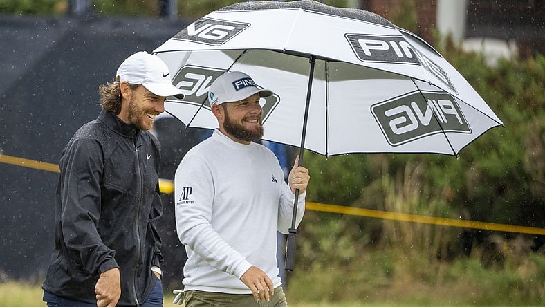 July 18, 2023; Hoylake, ENGLAND, GBR; Tommy Fleetwood (left) and Tyrrell Hatton (right) talk on the fourth hole during a practice round of The Open Championship golf tournament at Royal Liverpool. Mandatory Credit: Kyle Terada-USA TODAY Sports
