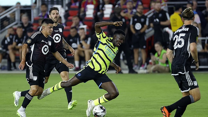 Jul 19, 2023; Washington, DC, USA; MLS midfielder Thiago Almada (23) of Atlanta United fouls Arsenal midfielder Bukayo Saka (7) during the first half of the 2023 MLS All Star Game at Audi Field. Mandatory Credit: Geoff Burke-USA TODAY Sports