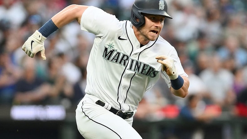 Jul 19, 2023; Seattle, Washington, USA; Seattle Mariners left fielder Jarred Kelenic (10) runs toward first base after hitting a single against the Minnesota Twins during the seventh inning at T-Mobile Park. Mandatory Credit: Steven Bisig-USA TODAY Sports