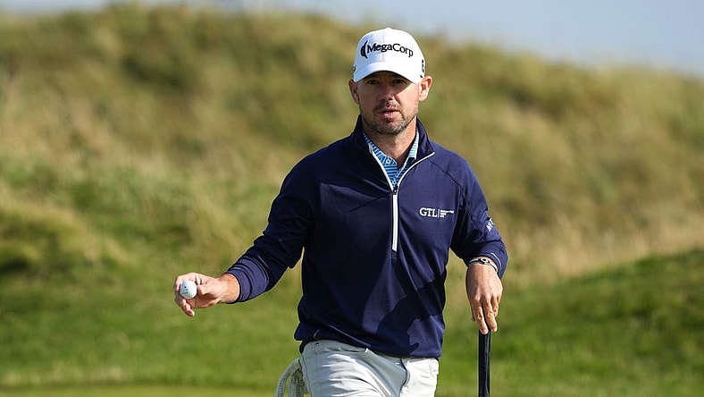 July 20, 2023; Hoylake, England, GBR; Brian Harman acknowledges the crowd after a putt during the first round of The Open Championship golf tournament at Royal Liverpool. Mandatory Credit: Kyle Terada-USA TODAY Sports
