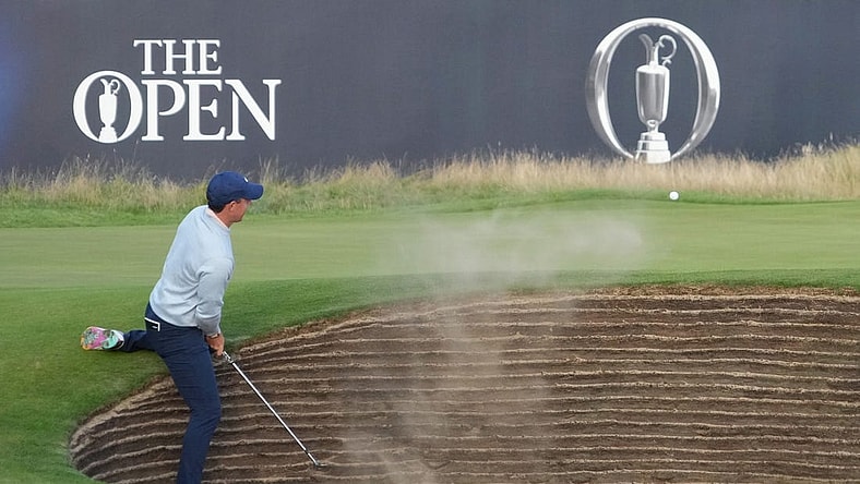 July 20, 2023; Hoylake, England, GBR; Rory McIlroy plays a shot from a bunker on the 18th hole during the first round of The Open Championship golf tournament at Royal Liverpool. Mandatory Credit: Kyle Terada-USA TODAY Sports