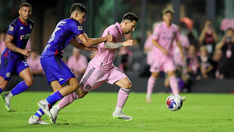 Jul 21, 2023; Fort Lauderdale, FL, USA; Inter Miami CF forward Lionel Messi (10) dribbles the ball against Cruz Azul defender Rafael Guerrero (33) during the second half at DRV PNK Stadium. Mandatory Credit: Sam Navarro-USA TODAY Sports