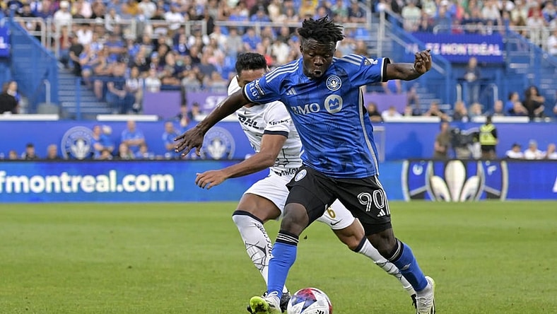 Jul 22, 2023; Montreal, Quebec, CAN; CF Montreal forward Kwadwo Opoku (90) dribbles against UNAM defender Nathan Silva (6) during the first half of a Leagues Cup game at Stade Saputo. Mandatory Credit: Eric Bolte-USA TODAY Sports