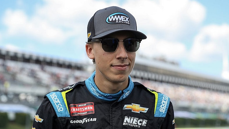 Jul 22, 2023; Long Pond, Pennsylvania, USA; NASCAR Craftsman Truck Series driver Carson Hocevar stands on pit road prior to the CRC Brakleen 150 at Pocono Raceway. Mandatory Credit: Matthew O'Haren-USA TODAY Sports