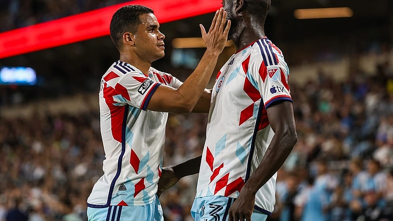 Jul 27, 2023; Saint Paul, MN, USA; Chicago Fire forward Kei Kamara (23) celebrates his goal with defender Miguel Angel Navarro (6) during the second half against the Minnesota United at Allianz Field. Mandatory Credit: Matt Krohn-USA TODAY Sports