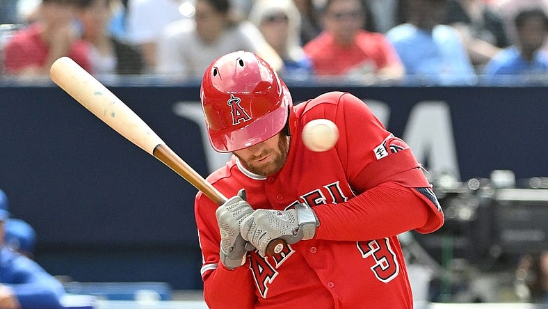 Jul 29, 2023; Toronto, Ontario, CAN; Los Angeles Angels left fielder Taylor Ward (3) is struck in the head by a pitch from Toronto Blue Jays pitcher Alek Manoah (not shown) in the fifth inning at Rogers Centre. Mandatory Credit: Dan Hamilton-USA TODAY Sports