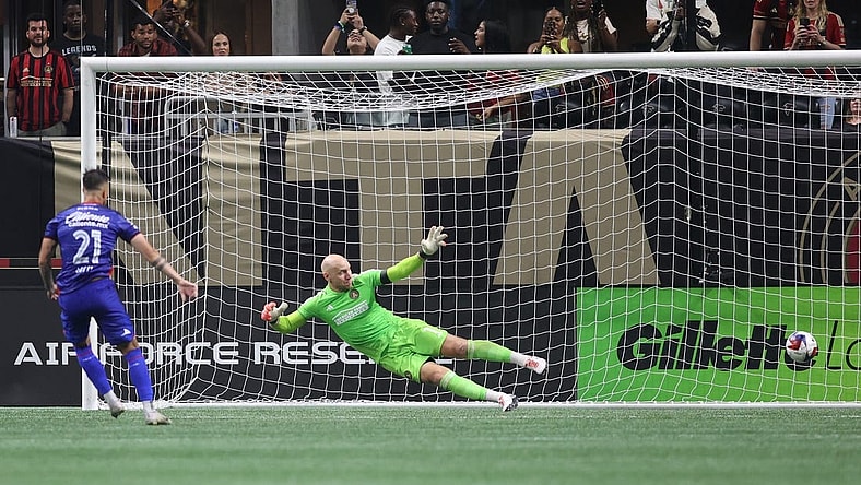Jul 29, 2023; Atlanta, GA, USA; Cruz Azul forward Augusto Lotti (21) scores a goal during penalty shootout against Atlanta United goalkeeper Brad Guzan (1) at Mercedes-Benz Stadium. Mandatory Credit: Brett Davis-USA TODAY Sports