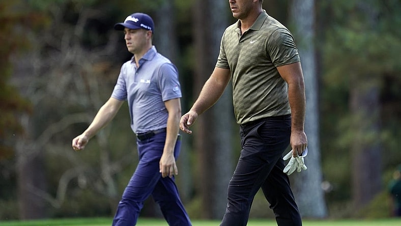 Nov 13, 2020; Augusta, Georgia, USA; Brooks Koepka and Justin Thomas walk up the 14th fairway during the second round of The Masters golf tournament at Augusta National GC. Mandatory Credit: Rob Schumacher-USA TODAY Sports