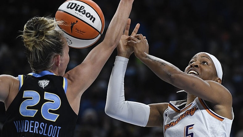 Oct 15, 2021; Chicago, Illinois, USA; Chicago Sky guard Courtney Vandersloot (22) blocks Phoenix Mercury guard Shey Peddy (5) during the first half of game three of the 2021 WNBA Finals at Wintrust Arena. Mandatory Credit: Matt Marton-USA TODAY Sports
