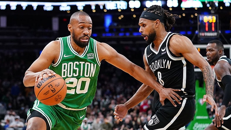 Nov 24, 2021; Boston, Massachusetts, USA; Boston Celtics forward Jabari Parker (20) drives the ball against Brooklyn Nets guard Patty Mills (8) in the second half at TD Garden. Mandatory Credit: David Butler II-USA TODAY Sports