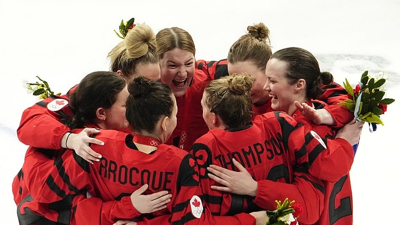 Feb 17, 2022; Beijing, China; Team Canada players celebrate after the medals ceremony during the Beijing 2022 Olympic Winter Games at Wukesong Sports Centre. Mandatory Credit: Rob Schumacher-USA TODAY Sports