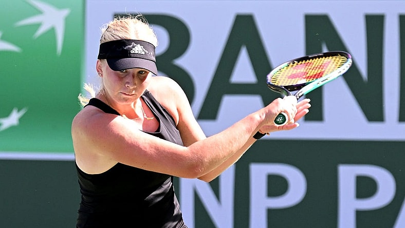 Mar 13, 2022; Indian Wells, CA, USA; Clara Tauson (DEN) hits a shot during her third round match against  Iga Swiatek (POL)at the BNP Paribas Open at the Indian Wells Tennis Garden. Mandatory Credit: Jayne Kamin-Oncea-USA TODAY Sports