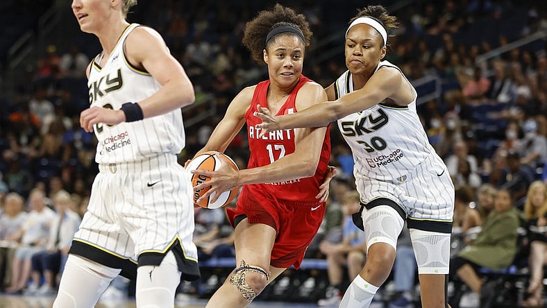 Jun 17, 2022; Chicago, Illinois, USA; Atlanta Dream forward Nia Coffey (12) drives to the basket against Chicago Sky forward Azura Stevens (30) during the first half of a WNBA game at Wintrust Arena. Mandatory Credit: Kamil Krzaczynski-USA TODAY Sports