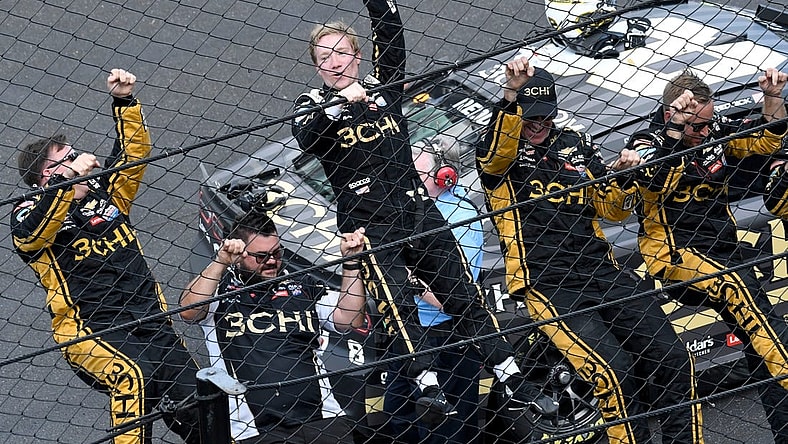 NASCAR Cup Series driver Tyler Reddick (8) and his team climb the fence Sunday, July 31, 2022, after winning the Verizon 200 at the Brickyard at Indianapolis Motor Speedway.

MAIN IMAGE 073122 Nascarverizon200 0027