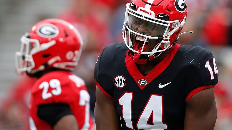 Georgia's Arik Gilbert (14) celebrates after making a touchdown catch during the G-Day spring game in Athens, Ga., on Saturday, April 16, 2022.

News Joshua L Jones

Syndication Online Athens