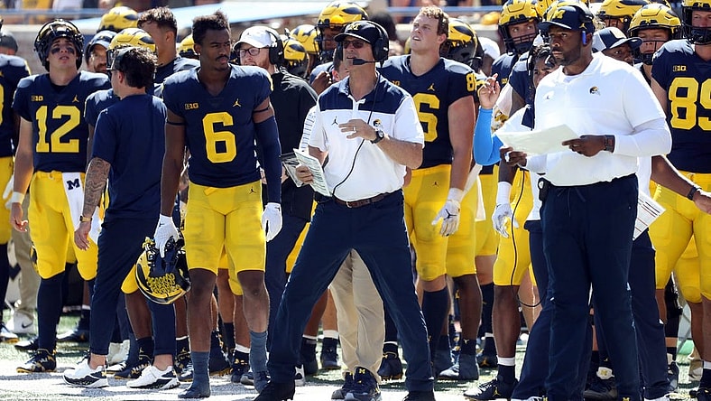 Michigan Wolverines head coach Jim Harbaugh and offensive coordinator Sherrone Moore, pictured during 

Michigan's 2022 season opener.