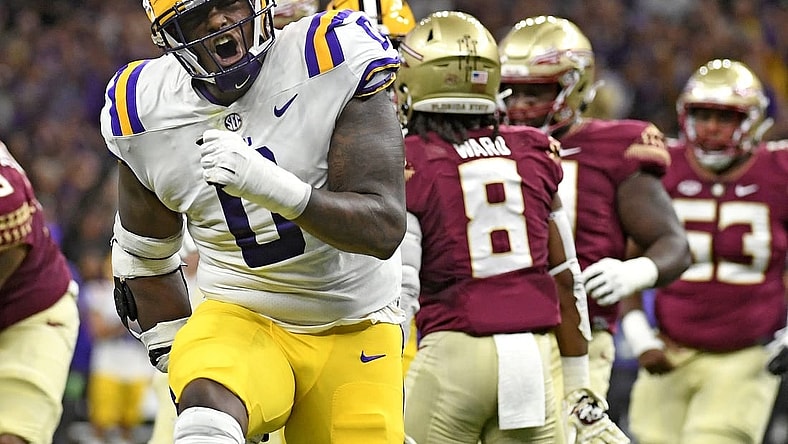 Sep 4, 2022; New Orleans, Louisiana, USA; Louisiana State Tigers defensive tackle Maason Smith (0) celebrates a play during the first half against the Florida State Seminoles at Caesars Superdome. Mandatory Credit: Melina Myers-USA TODAY Sports