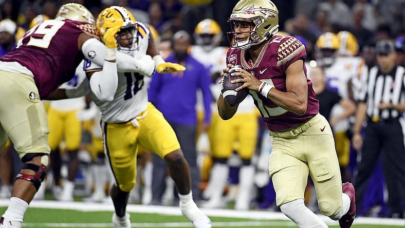 Sep 4, 2022; New Orleans, Louisiana, USA; Florida State Seminoles quarterback Jordan Travis (13) scrambles during the first half against the Louisiana State Tigers at Caesars Superdome. Mandatory Credit: Melina Myers-USA TODAY Sports