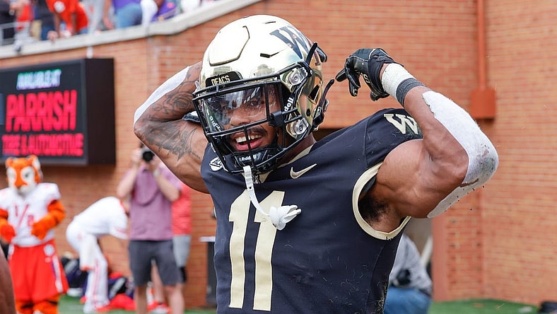Sep 24, 2022; Winston-Salem, North Carolina, USA;  Wake Forest Demon Deacons wide receiver Donavon Greene (11) celebrates a touchdown during the second half against the Clemson Tigers at Truist Field. Mandatory Credit: Reinhold Matay-USA TODAY Sports