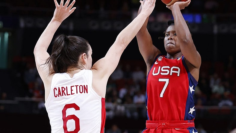 Sep 30, 2022; Sydney, AUS; USA player Ariel Atkins (7) makes a shot against Canada player Bridget Carleton (6) in the second quarter at Sydney SuperDome. Mandatory Credit: Yukihito Taguchi-USA TODAY Sports