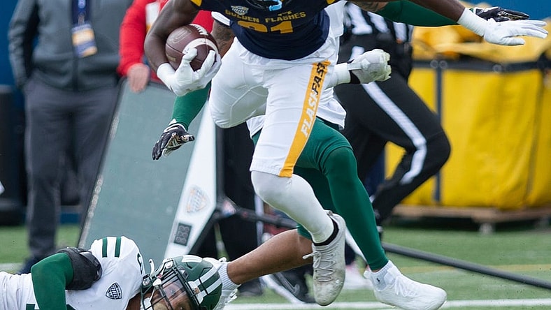 Kent State University hosted Ohio University for the 2022 Homecoming game on Saturday, October 1. The Golden Flashes win in overtime, 31-24. Devontez Walker break free of defender Zack Sanders and gets more yards.

Ksu V Ou 100122 Ls06