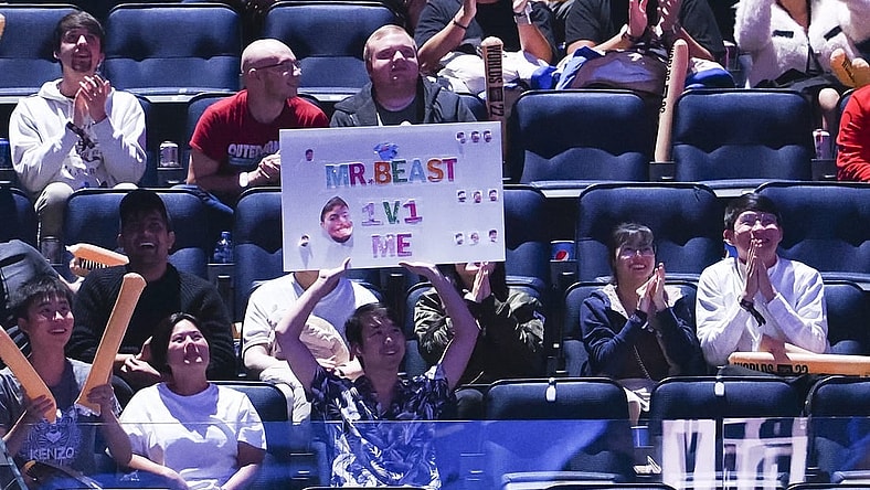 Nov 5, 2022; San Francisco, California, USA; A fan holds a sign during the League of Legends World Championships between T1 and DRX at Chase Center. Mandatory Credit: Kelley L Cox-USA TODAY Sports