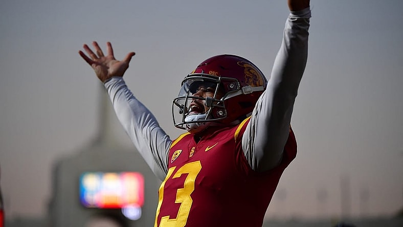 Southern California Trojans quarterback Caleb Williams (13) celebrates Tahj Washington (16) scoring a touchdown against the Notre Dame Fighting Irish during the first half at the Los Angeles Memorial Coliseum. Mandatory Credit: Gary A. Vasquez-USA TODAY Sports