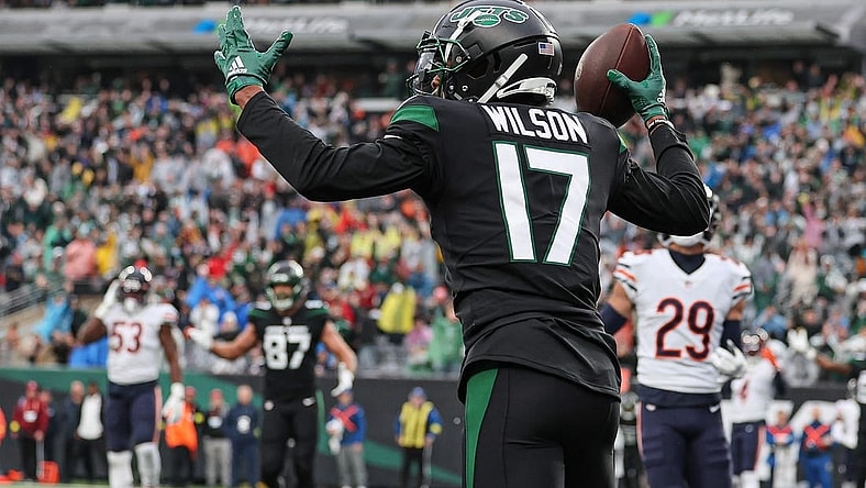 Nov 27, 2022; East Rutherford, New Jersey, USA; New York Jets wide receiver Garrett Wilson (17) celebrates his touchdown reception during the first quarter against the Chicago Bears at MetLife Stadium. Mandatory Credit: Vincent Carchietta-USA TODAY Sports