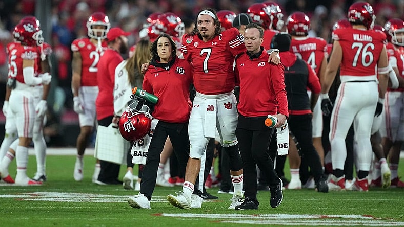 Jan 2, 2023; Pasadena, California, USA; Utah Utes quarterback Cameron Rising (7) walks with assistance off the field in the second half against the Penn State Nittany Lions of the 109th Rose Bowl game at the Rose Bowl. Mandatory Credit: Kirby Lee-USA TODAY Sports