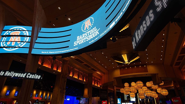 Digital banners advertise Barstool Sportsbook within Hollywood Casino where people can how legally place sports bets in the state.