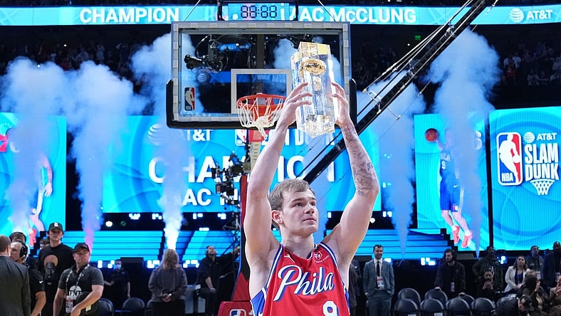 Feb 18, 2023; Salt Lake City, UT, USA; Philadelphia 76ers guard Mac McClung (9) celebrates with the trophy after winning the Dunk Contest during the 2023 All Star Saturday Night at Vivint Arena. Mandatory Credit: Kyle Terada-USA TODAY Sports