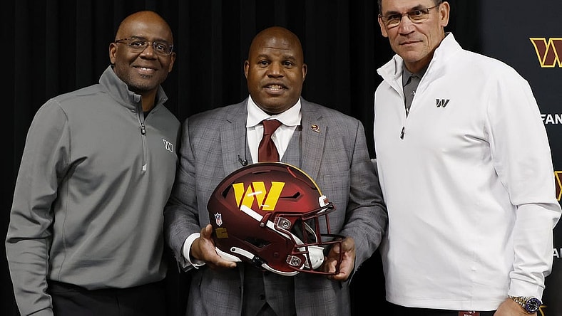 Feb 23, 2023; Ashburn, Virginia, USA; Eric Bieniemy (M) poses with Washington Commanders general manager Martin Mayhew (L) and Commanders head coach Ron Rivera (R) after being introduced as the new Commanders offensive coordinator and assistant head coach during an introductory press conference at Commanders Park. Mandatory Credit: Geoff Burke-USA TODAY Sports