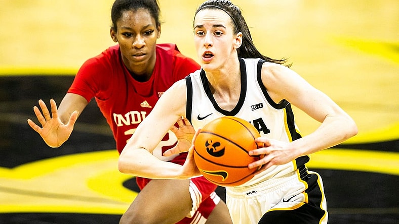Iowa guard Caitlin Clark, right, passes the ball as Indiana guard Chloe Moore-McNeil defends during a NCAA Big Ten Conference women's basketball game, Sunday, Feb. 26, 2023, at Carver-Hawkeye Arena in Iowa City, Iowa.

230226 Indiana Iowa Wbb 036 Jpg