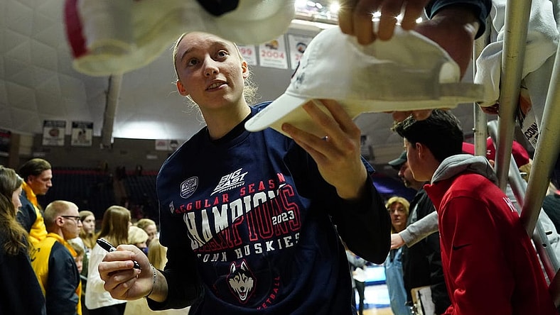 Feb 27, 2023; Storrs, Connecticut, USA; UConn Huskies guard Paige Bueckers (5) signs autographs after her teammates defeated the Xavier Musketeers at Harry A. Gampel Pavilion. Mandatory Credit: David Butler II-USA TODAY Sports