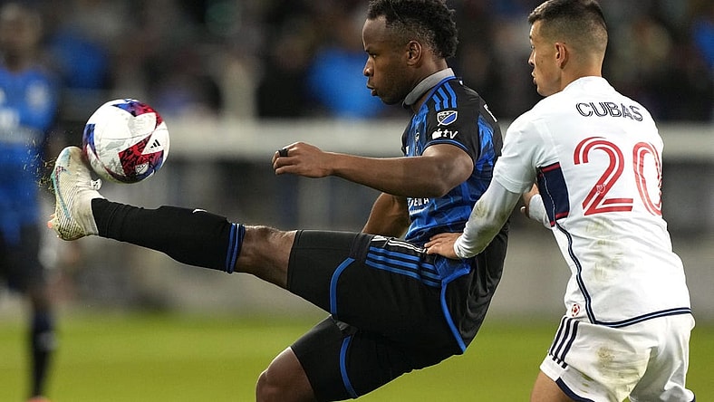Mar 4, 2023; San Jose, California, USA; San Jose Earthquakes forward Jeremy Ebobisse (11) controls the ball against Vancouver Whitecaps midfielder Andres Cubas (20) during the second half at PayPal Park. Mandatory Credit: Darren Yamashita-USA TODAY Sports