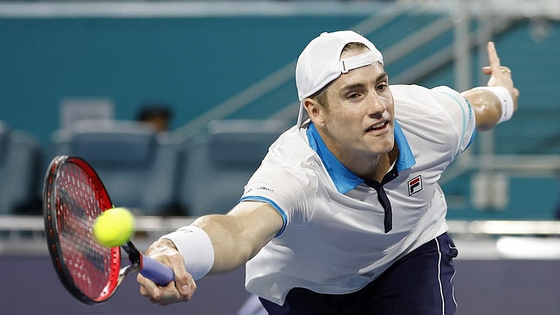 Mar 22, 2023; Miami, Florida, US; John Isner (USA) hits a volley against Emilio Nara (USA) (not pictured) on day three of the Miami Open at Hard Rock Stadium. Mandatory Credit: Geoff Burke-USA TODAY Sports