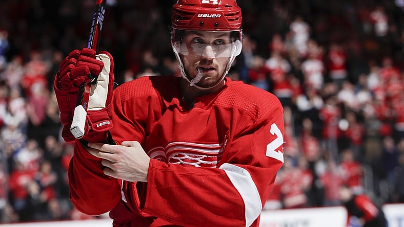 Mar 23, 2023; Detroit, Michigan, USA; Detroit Red Wings center Pius Suter (24) adjusts his glove during the second period against the St. Louis Blues at Little Caesars Arena. Mandatory Credit: Brian Bradshaw Sevald-USA TODAY Sports