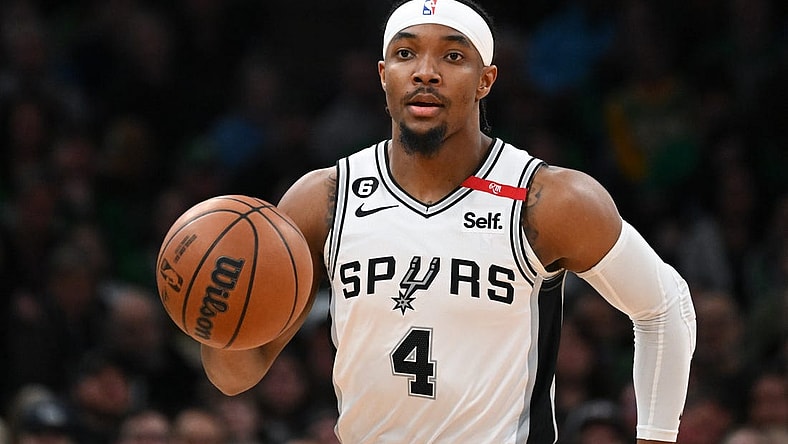 Mar 26, 2023; Boston, Massachusetts, USA; San Antonio Spurs guard Devonte' Graham (4) dribbles the ball against the Boston Celtics during the first quarter at the TD Garden. Mandatory Credit: Brian Fluharty-USA TODAY Sports