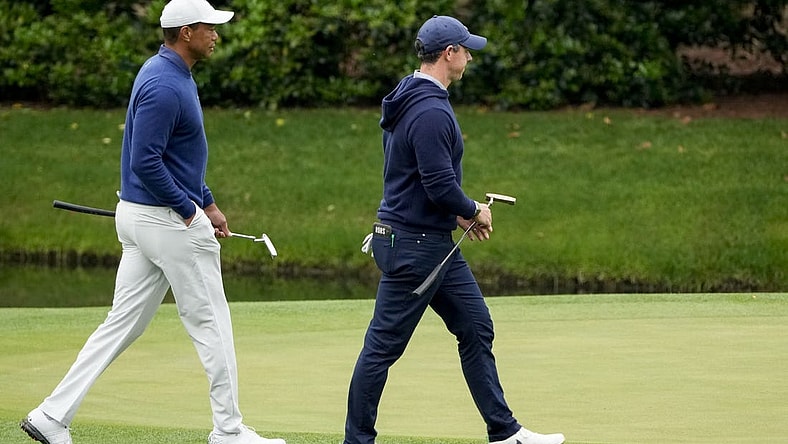 Apr 3, 2023; Augusta, Georgia, USA; Tiger Woods and Rory McIlroy walk onto the 11th green during a practice round for The Masters golf tournament at Augusta National Golf Club. Mandatory Credit: Michael Madrid-USA TODAY Network