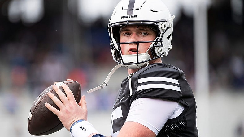 Penn State quarterback Drew Allar warms up on the sideline during the Blue-White game at Beaver Stadium on Saturday, April 15, 2023, in State College.

230415 Hes Dr Bluewhite