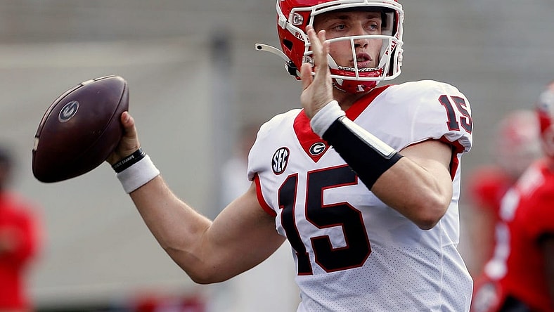 Georgia quarterback Carson Beck (15) throws the ball during the UGA G-Day spring football game at Sanford Stadium in Athens on Saturday.

News Joshua L Jones