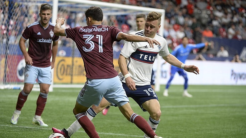 Apr 29, 2023; Vancouver, British Columbia, CAN;  Vancouver Whitecaps FC midfielder Julian Gressel (19) defends against Colorado Rapids defender Anthony Markanich (31) during the second half at BC Place. Mandatory Credit: Anne-Marie Sorvin-USA TODAY Sports