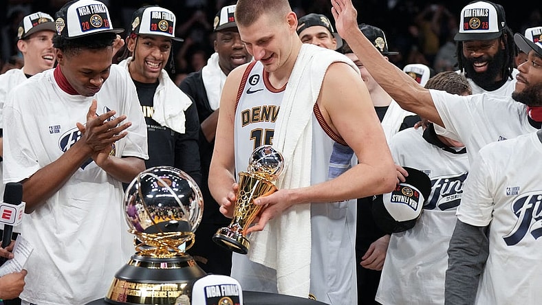 May 22, 2023; Los Angeles, California, USA; Denver Nuggets center Nikola Jokic (15) celebrates winning the Western Conference MVP Trophy and beating the Los Angeles Lakers in game four of the Western Conference Finals for the 2023 NBA playoffs at Crypto.com Arena. Mandatory Credit: Kirby Lee-USA TODAY Sports